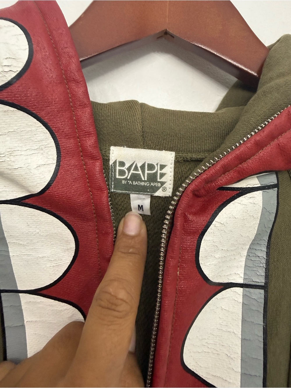 Bape Kaws Olive Green Hoodie Sweater with Red Shark-Print Trim